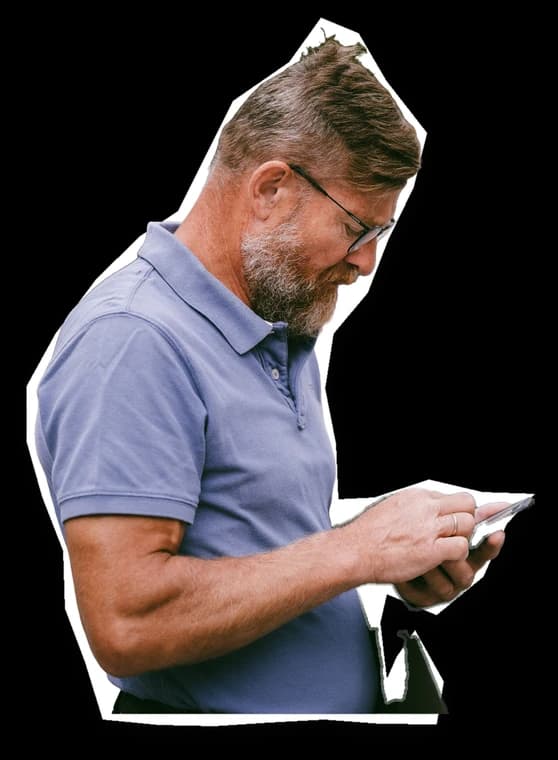 A man reading a message on his phone